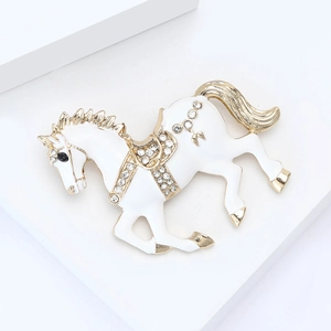 Elegant white enamel horse brooch with sparkling rhinestones in a golden frame