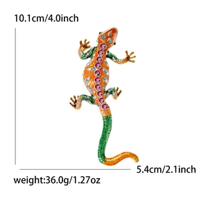 Detailed enamel lizard brooch in green and orange with crystal stones, 10.1cm length