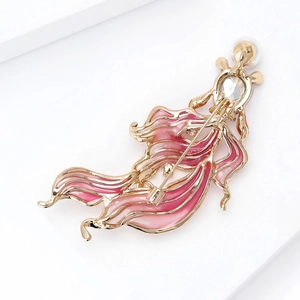 Close-up of pink enamel goldfish brooch with gold plating and sparkling water-drop rhinestone