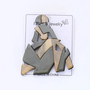 Abstract acrylic woman brooch with marble texture detail on fashion jewelry card