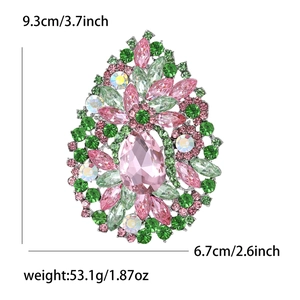 Dimensions détaillées de la broche en cristal rose et vert mesurant 9,3x6,7 cm