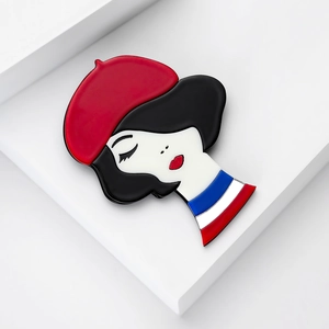 Minimalist acrylic brooch featuring a chic woman in a red beret with French style stripes