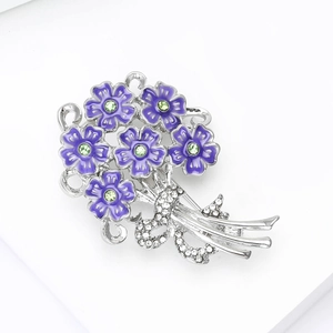 Detailed close-up of purple enamel hydrangea brooch with green rhinestones and silver finish
