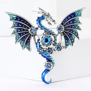 Mechanical dragon brooch in silver metal with blue enamel wings and blue gemstones