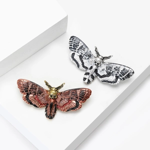 Gothic moth brooch with skull design in vintage silver and bronze finish for suit lapels