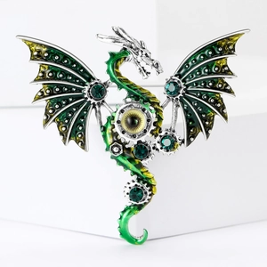 Macro detail of steampunk dragon brooch with green enamel wings and mechanical gears