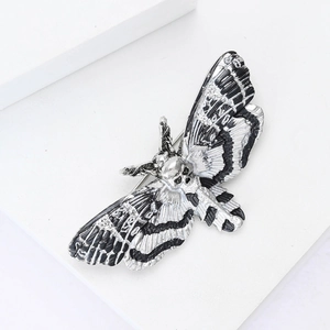 Macro detail of the death's-head hawkmoth brooch featuring intricate wing texture