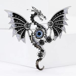 Macro detail of steampunk dragon brooch with blue eye element and mechanical gears