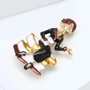 Detail view of retro female character brooch with red hat and enamel glaze finish
