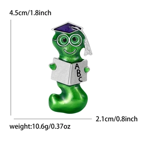 Enamel bookworm brooch for clothes with dimension specs 4.5cm by 2.1cm on white background
