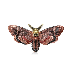 Gothic moth brooch with skull head and red enamel wings in vintage bronze finish