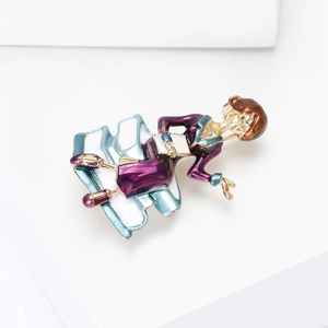 Detail of female teacher brooch with purple dress and blue books in gold enamel finish