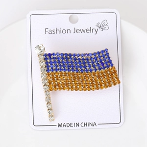 Detailed view of Ukraine flag rhinestone brooch with blue and yellow crystals