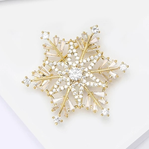 Elegant 3D snowflake brooch with sparkling cubic zirconia on a gold base