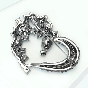 Detailed back view of vintage rhinestone heart brooch with secure pin and safety clasp