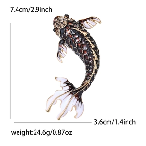 Detailed view of enamel koi fish brooch with dimensions 7.4cm by 3.6cm on white background