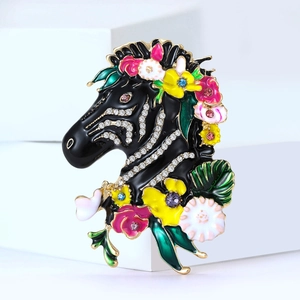 Exquisite zebra enamel brooch with colorful floral accents and sparkling crystals