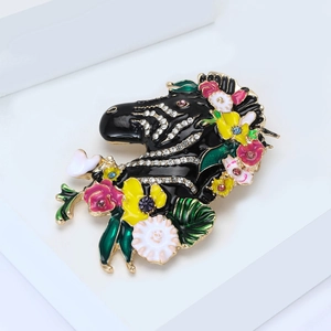 Artistic zebra brooch with colorful enamel flowers and sparkling rhinestones