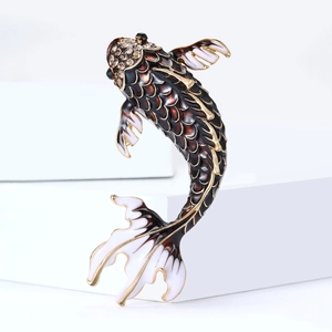 Detailed close-up of a koi fish brooch with dark enamel scales and sparkling rhinestones