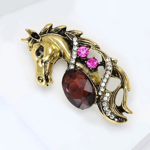 Vintage gold horse brooch with red enamel, white rhinestones and palace style design