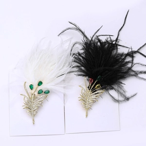 Detailed view of luxury feather brooches with zircon inlay and colorful gemstones