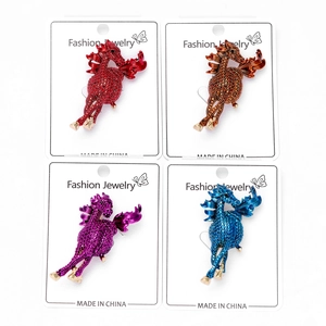 Detail of horse brooches in four colors featuring sparkling rhinestones on alloy base