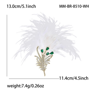Luxury feather brooch with gold base and emerald green gemstones, 5.1 inch length