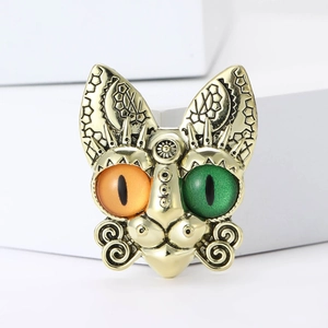Creative gold cat brooch with colorful mismatched eyes and tribal geometric patterns