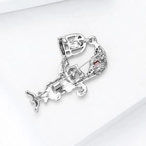Detail view of the silver vintage cat brooch featuring the secure back pin clasp mechanism