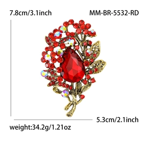 Vintage red crystal water drop brooch with colorful rhinestones on an antique gold frame