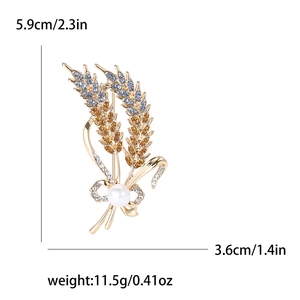 Elegant wheat stalk brooch with colorful rhinestones and white pearl on white background