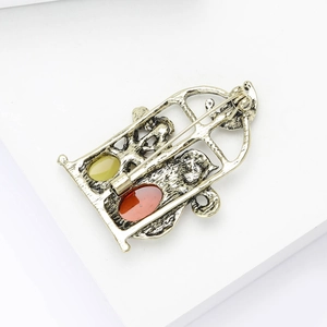 Detailed back view of vintage silver cat brooch with secure pin and metal texture