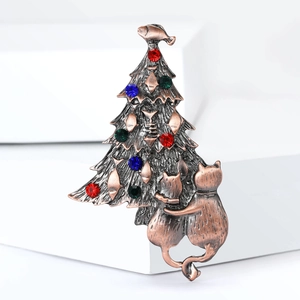Detail of vintage Christmas tree brooch with rhinestones and cat silhouettes