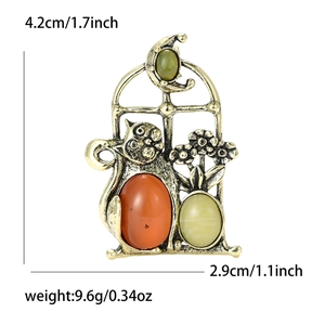 Vintage gold cat brooch with orange gemstone and rhinestone moon for elegant suits