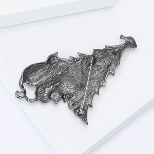 Detail of the gunmetal alloy Christmas tree brooch back with secure pin clasp mechanism