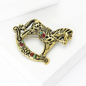 Vintage gold alloy rocking horse brooch with colorful enamel floral patterns