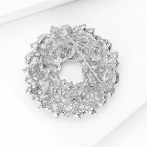 Detailed back view of silver alloy sunflower brooch showing secure pin fastener and metal texture