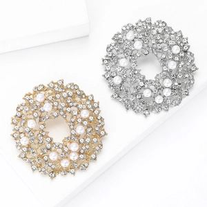 Elegant gold and silver sun flower wreaths brooches with pearls and rhinestones on white