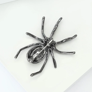 Detailed back view of vintage spider brooch featuring a secure silver safety pin clasp