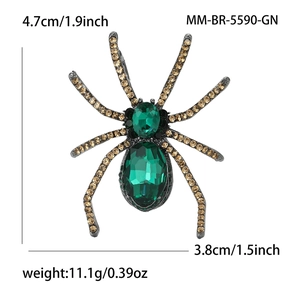 Detail showing vintage spider brooch size 4.7cm by 3.8cm with green gems and rhinestones