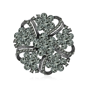 Retro rhinestone glass wreath brooch with dark grey gemstones and gunmetal finish