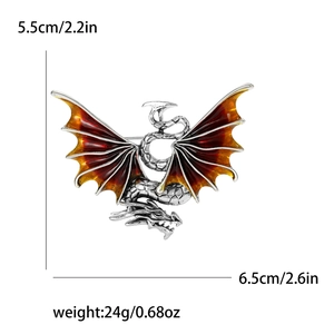 Detailed dragon brooch with red enamel wings and antique silver finish, 6.5cm size