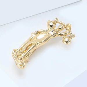 Detailed view of polished gold Nike of Samothrace sculpture brooch with artistic metal lines