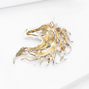 Detailed back view of horse head brooch showing secure pin clasp and gold plating
