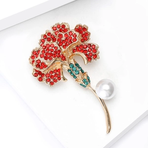 Detail of elegant carnation brooch with red rhinestones and white faux pearl
