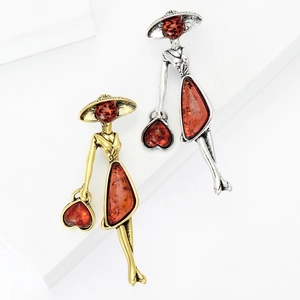 Vintage style lady brooch in gold and silver finish with amber resin hat and dress
