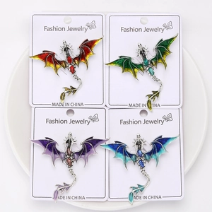 Set of four detailed enamel dragon brooches with gradient colors and gemstone spines
