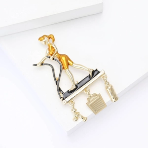 Creative fitness lady brooch with dangling dumbbell and water bottle in gold finish