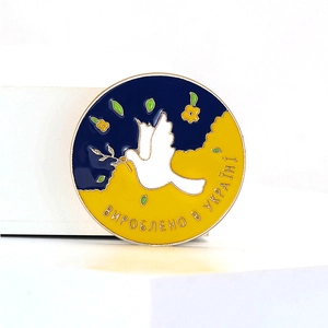 Vintage enamel dove brooch with blue and yellow colors and Ukrainian flower motif