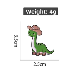 Detailed size and weight view of a green dinosaur enamel pin with cowboy hat and boots